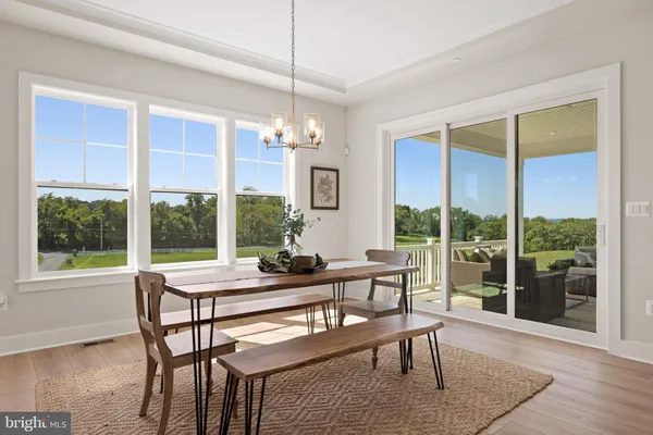 a kitchen with stainless steel appliances granite countertop a stove and white cabinets