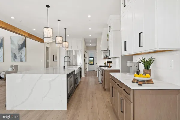 a living room with furniture large window and a fireplace