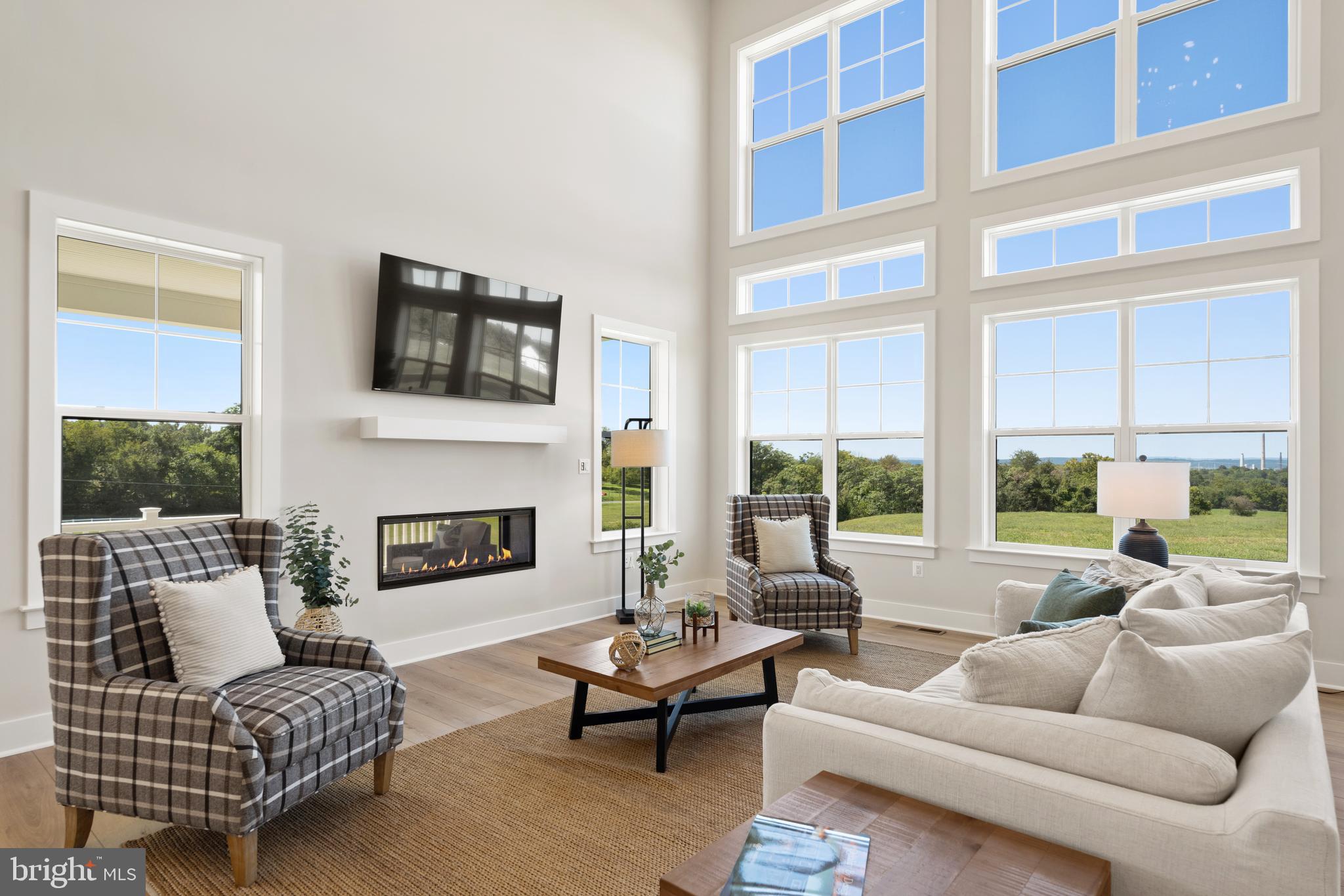 21331 Big Woods Road Dickerson, MD 20842 - Photo 20 of 79 a living room with furniture wooden floor and a large window