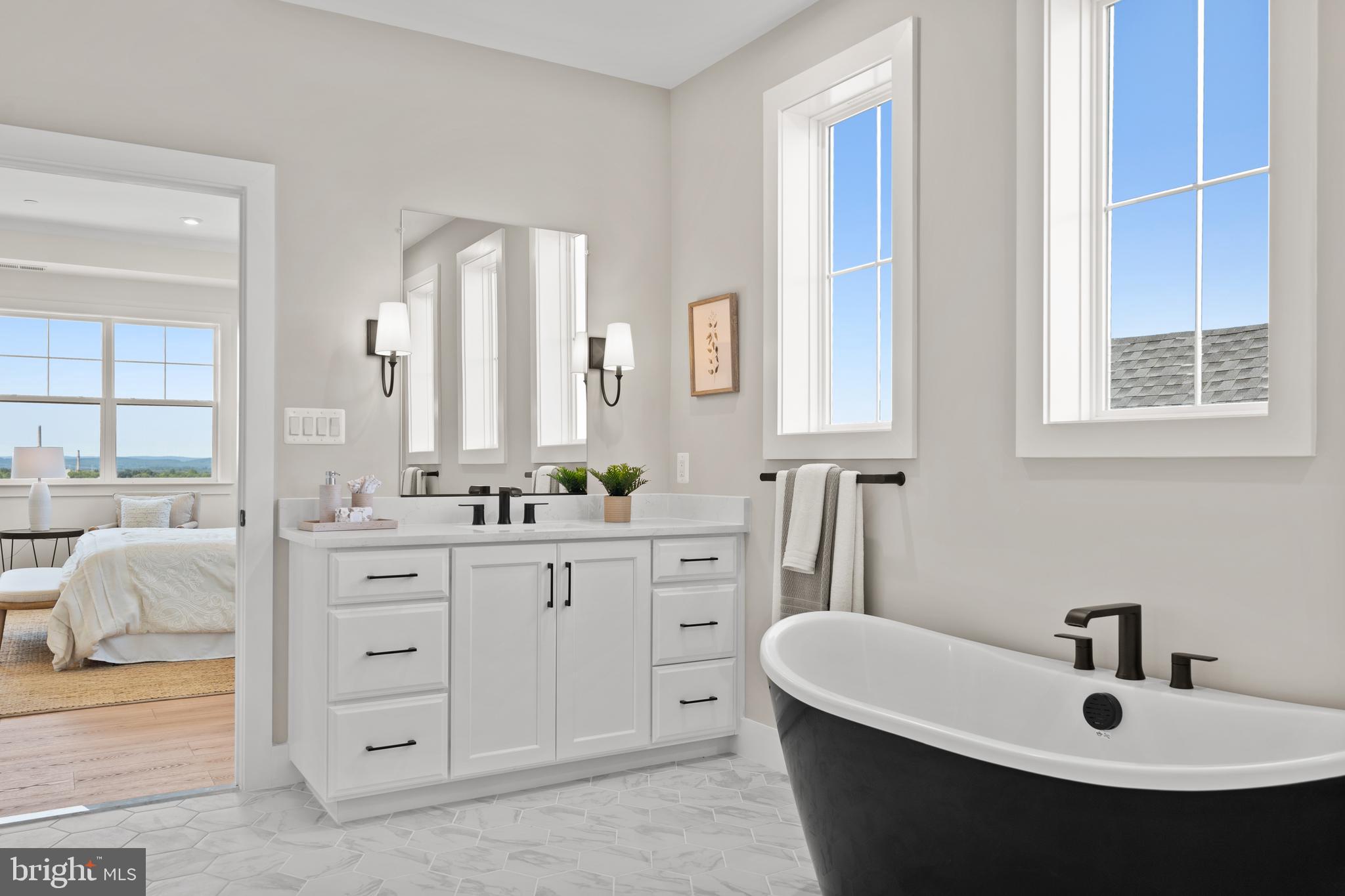 21331 Big Woods Road Dickerson, MD 20842 - Photo 40 of 79 a bathroom with a double vanity sink mirror and bathtub