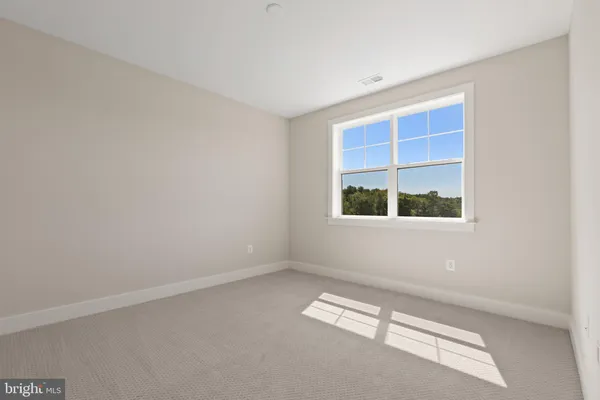 a bathroom with a toilet a sink and a mirror