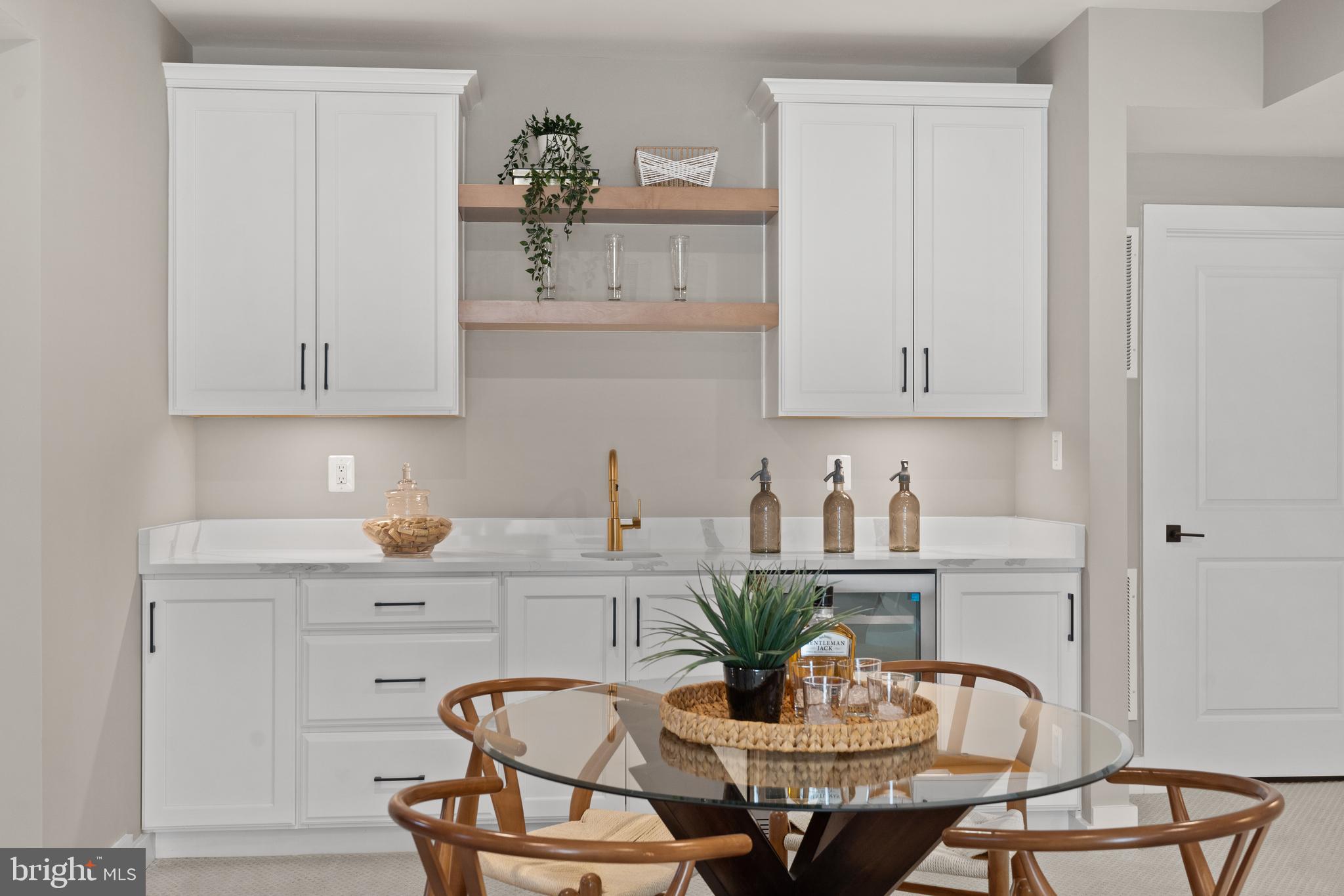 21331 Big Woods Road Dickerson, MD 20842 - Photo 58 of 79 a kitchen with a dining table and chairs