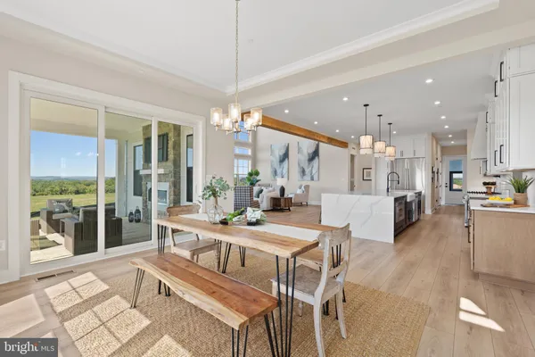 a large kitchen with stainless steel appliances kitchen island granite countertop a large center island attached withe living room