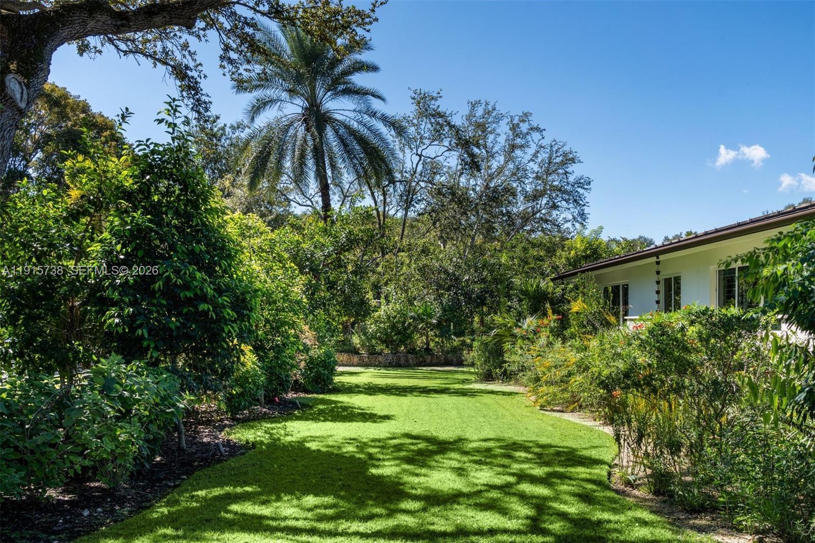 12050 Moss Ranch Road Pinecrest, FL 33156 - Photo 12 of 33 a view of a garden