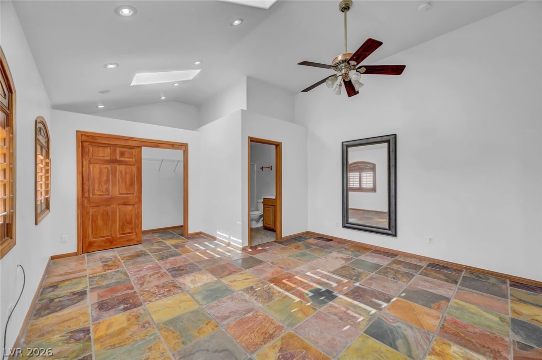 640 North Racetrack Road Henderson, NV 89015 - Photo 41 of 65 Natural light fills this room, showcasing colorful tile flooring and high ceilings with skylights.