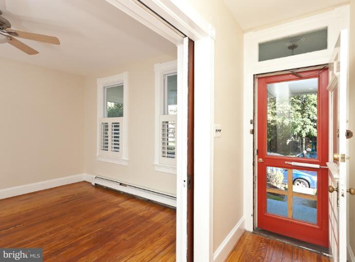 4612 Schenley Road Baltimore, MD 21210 - Photo 17 of 23 an empty room with wooden floor and windows
