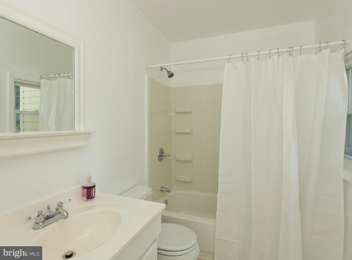 4612 Schenley Road Baltimore, MD 21210 - Photo 8 of 23 a bathroom with a sink a toilet and shower