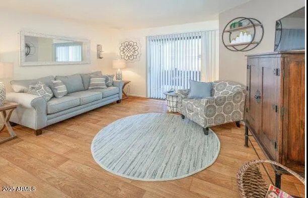 a living room with furniture and a window