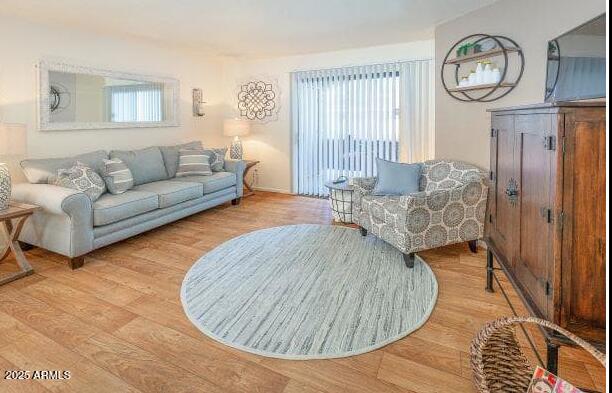 5740 North 59th Avenue, Unit 1B Glendale, AZ 85301 - Photo 2 of 10 a living room with furniture and a window