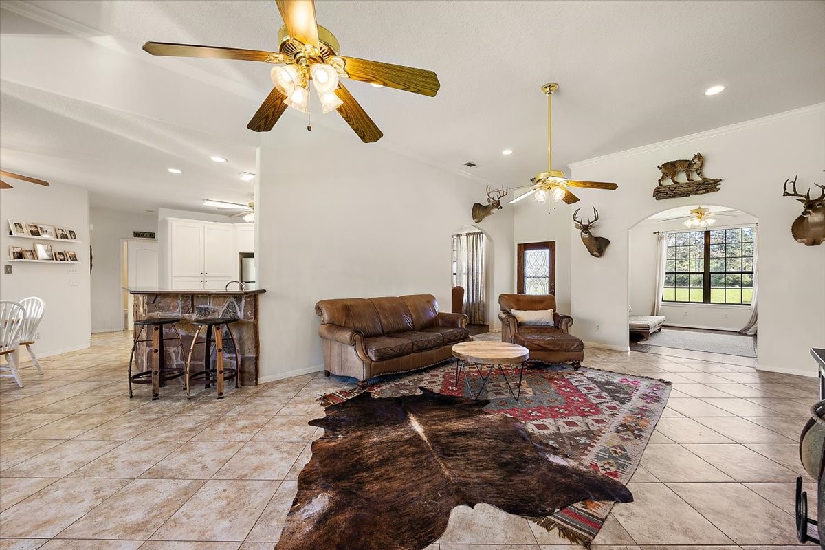 394 Farm To Market 230 Trinity, TX 75862 - Photo 12 of 50 a living room with lots of furniture and a chandelier