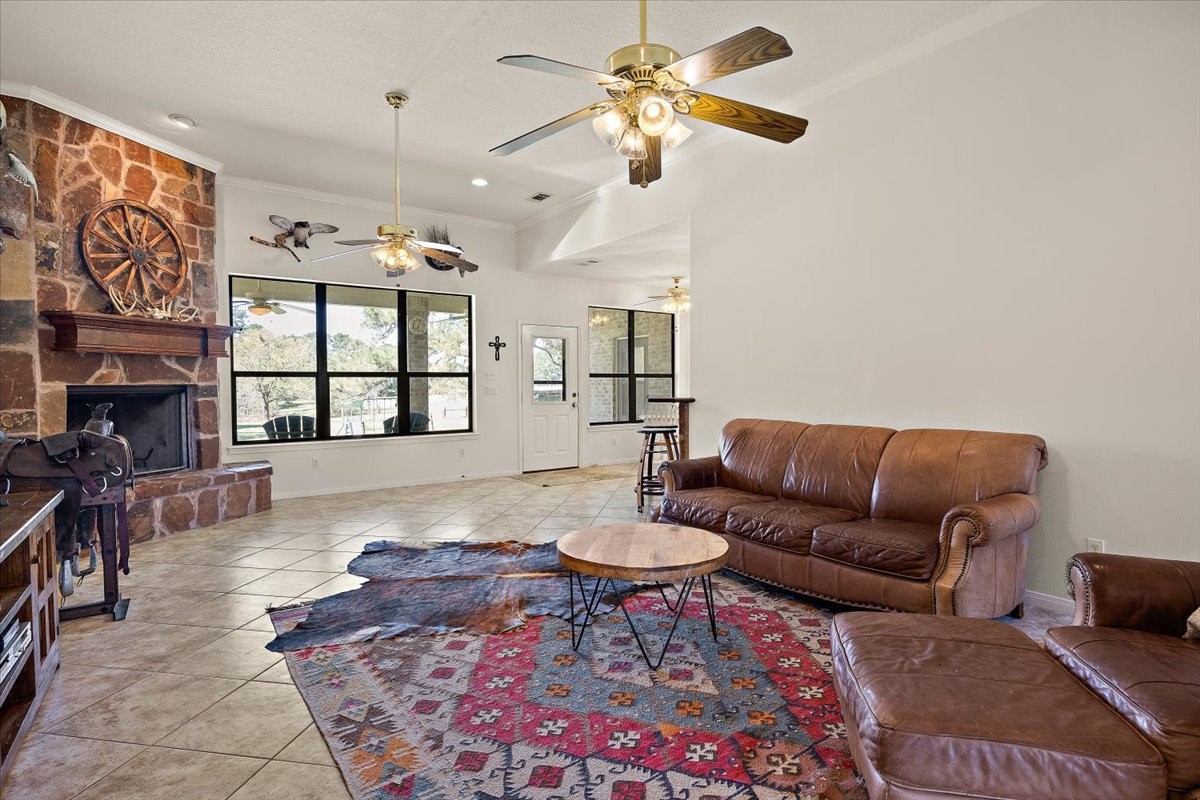 394 Farm To Market 230 Trinity, TX 75862 - Photo 15 of 50 a living room with furniture a rug and a chandelier