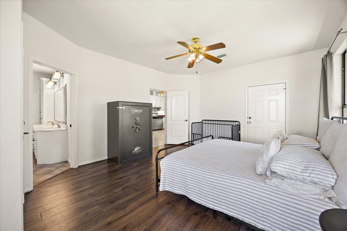 394 Farm To Market 230 Trinity, TX 75862 - Photo 24 of 50 a bedroom with a bed and a chandelier