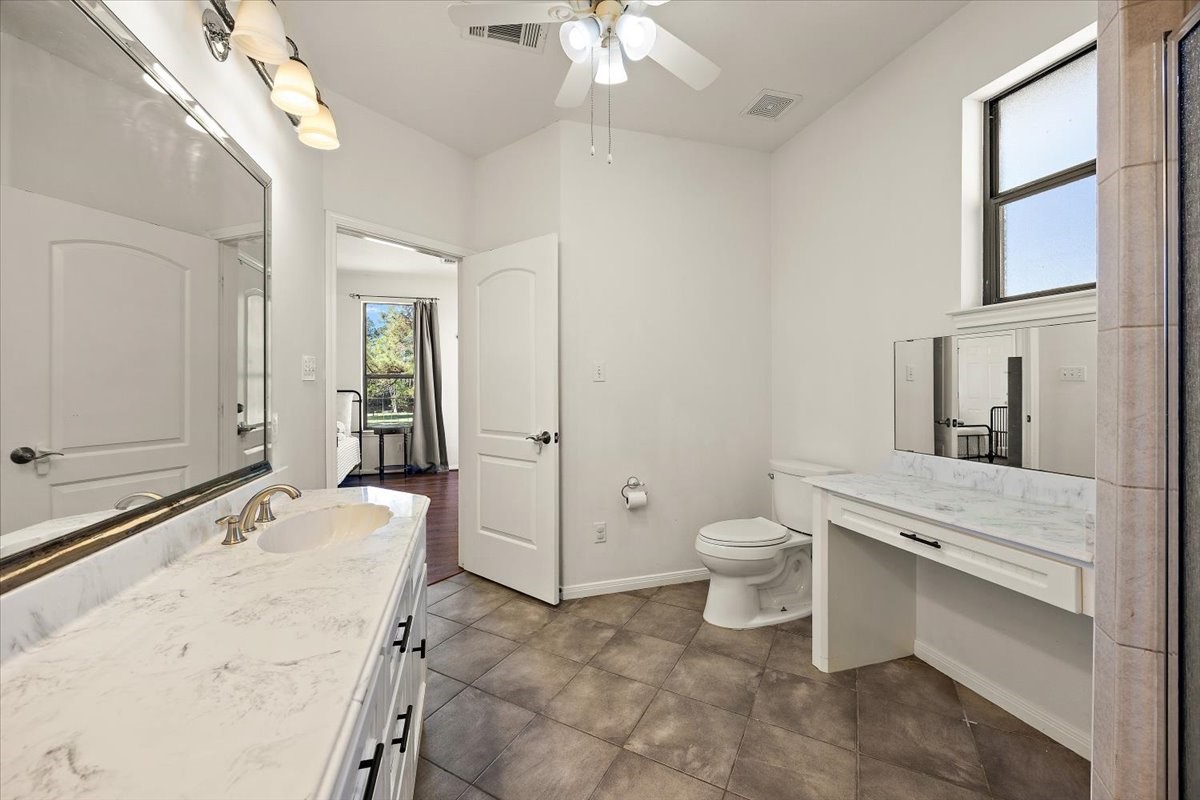 394 Farm To Market 230 Trinity, TX 75862 - Photo 27 of 50 a spacious bathroom with a granite countertop sink toilet and shower