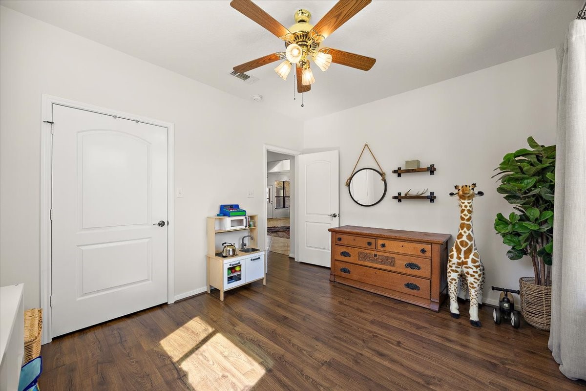 394 Farm To Market 230 Trinity, TX 75862 - Photo 29 of 50 a living room with furniture and a chandelier