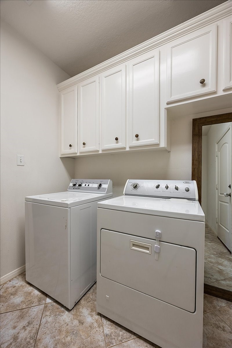 394 Farm To Market 230 Trinity, TX 75862 - Photo 36 of 50 a view of storage and utility room with washer and dryer
