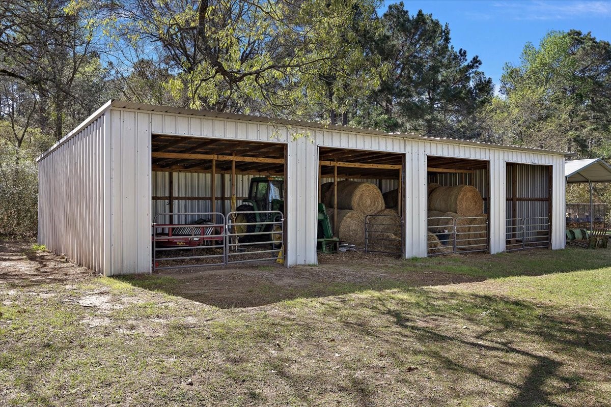 394 Farm To Market 230 Trinity, TX 75862 - Photo 38 of 50 a view of a house with a yard and garage