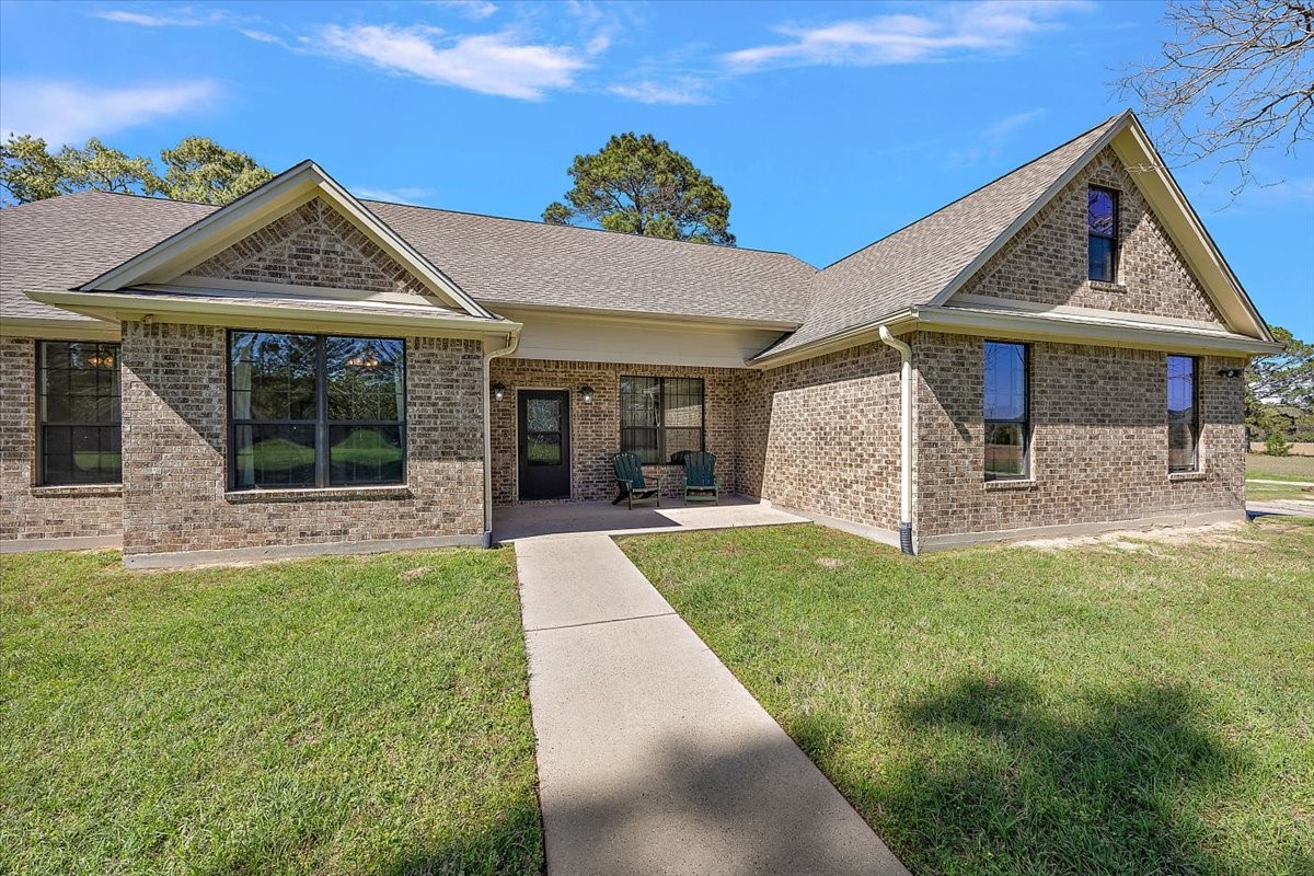 394 Farm To Market 230 Trinity, TX 75862 - Photo 4 of 50 a view of a house with garden and porch