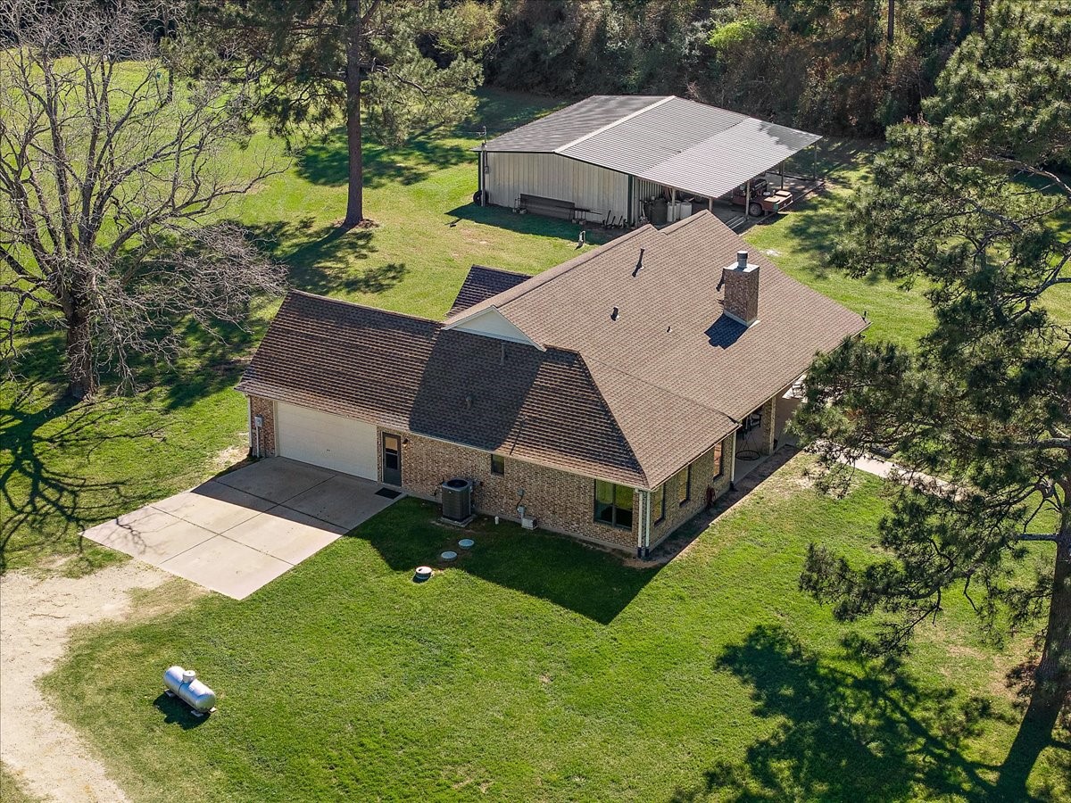 394 Farm To Market 230 Trinity, TX 75862 - Photo 10 of 50 an aerial view of a house with swimming pool