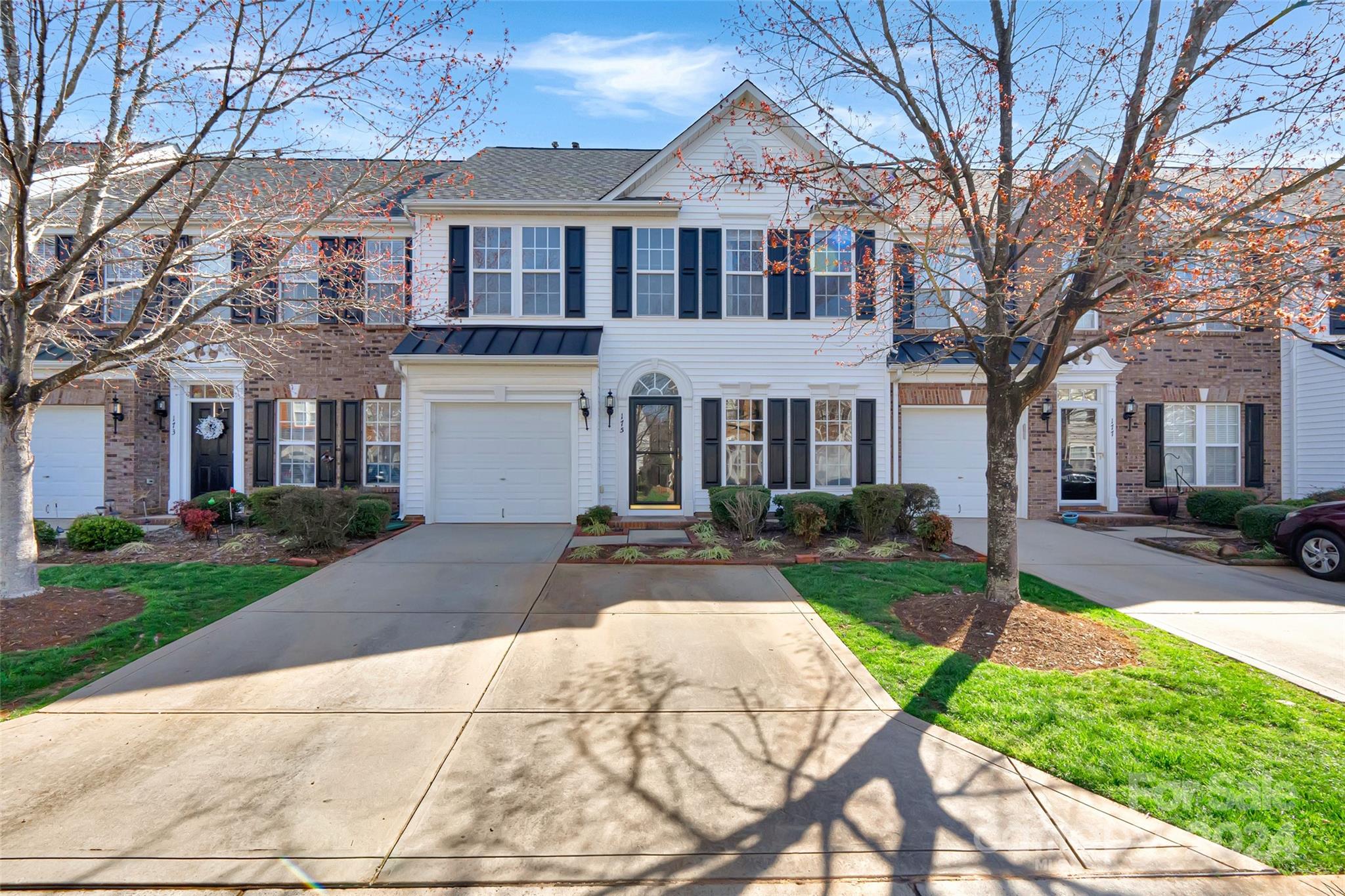 175 Snead Road Fort Mill, SC 29715 - Photo 1 of 26 a front view of a house with a yard and garage