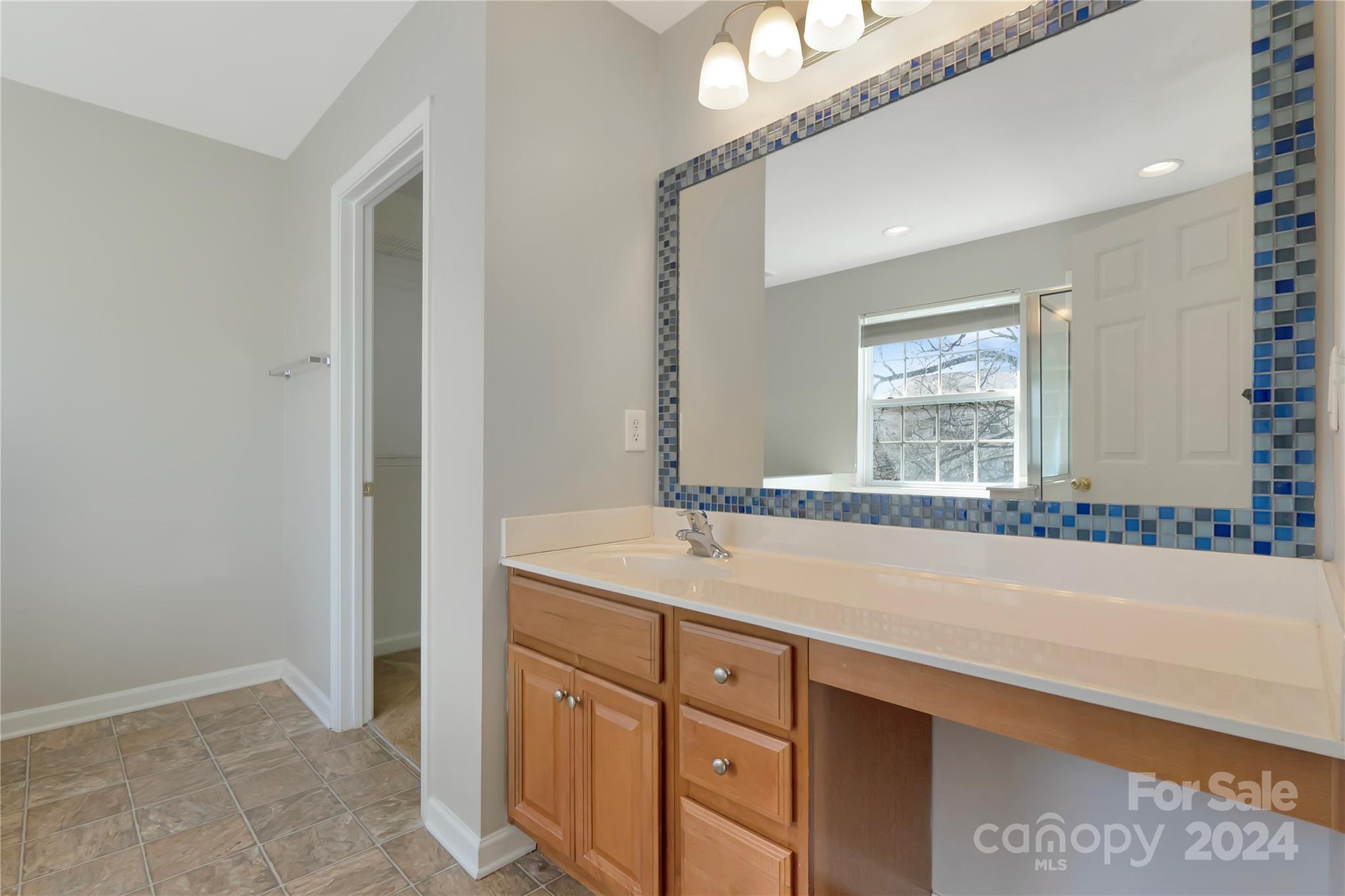 175 Snead Road Fort Mill, SC 29715 - Photo 14 of 26 a bathroom with a sink and a mirror