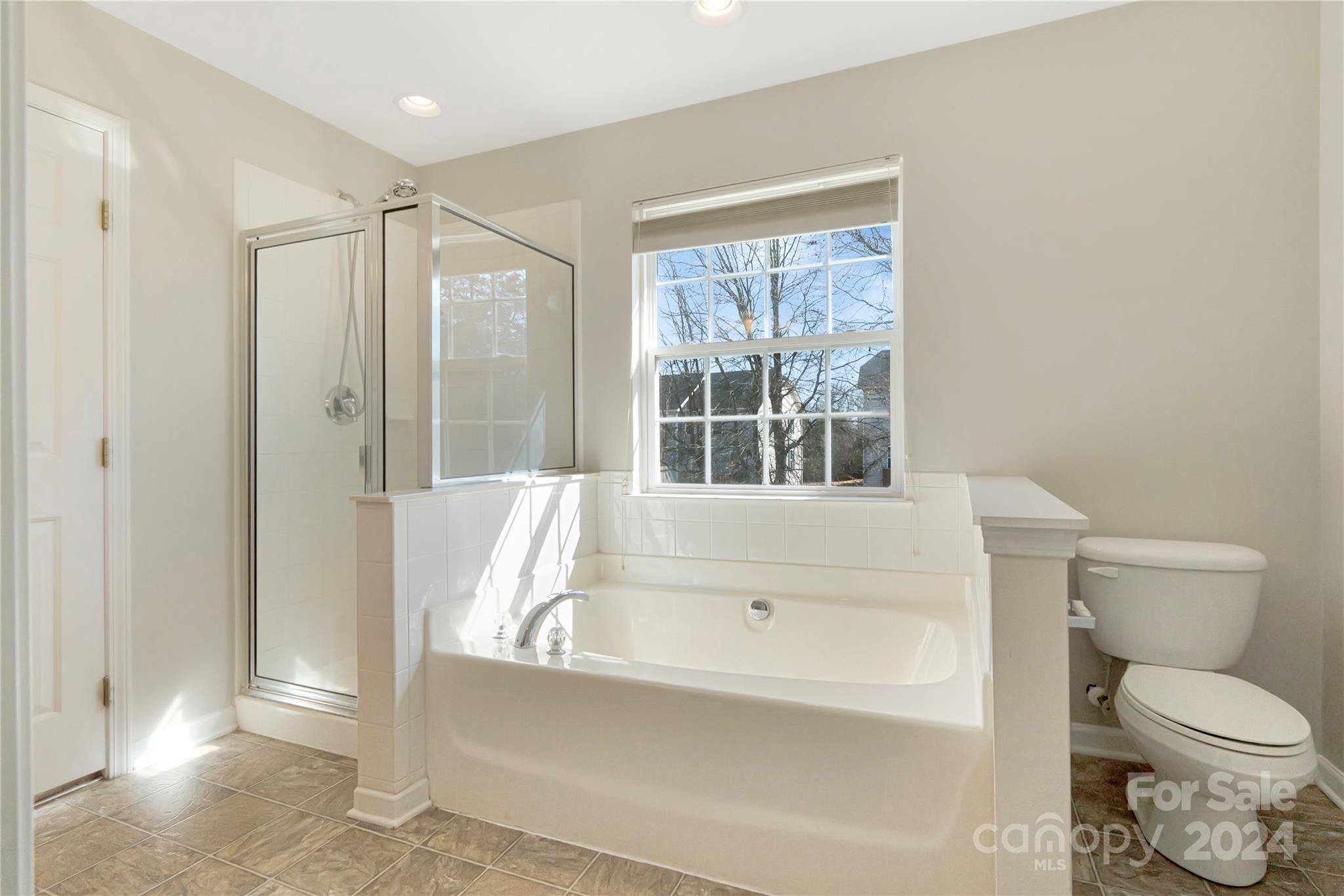 175 Snead Road Fort Mill, SC 29715 - Photo 15 of 26 a bathroom with a bathtub toilet and shower