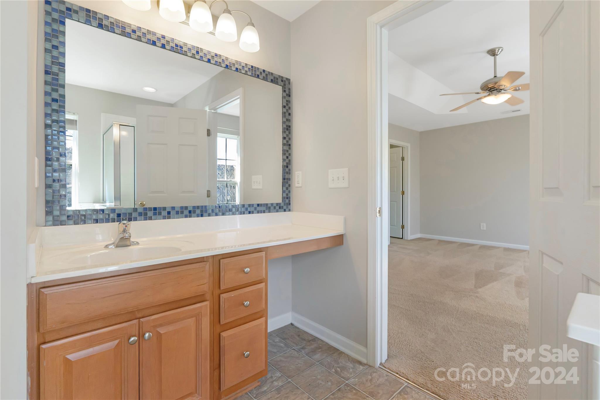 175 Snead Road Fort Mill, SC 29715 - Photo 16 of 26 a bathroom with a double vanity sink and a mirror