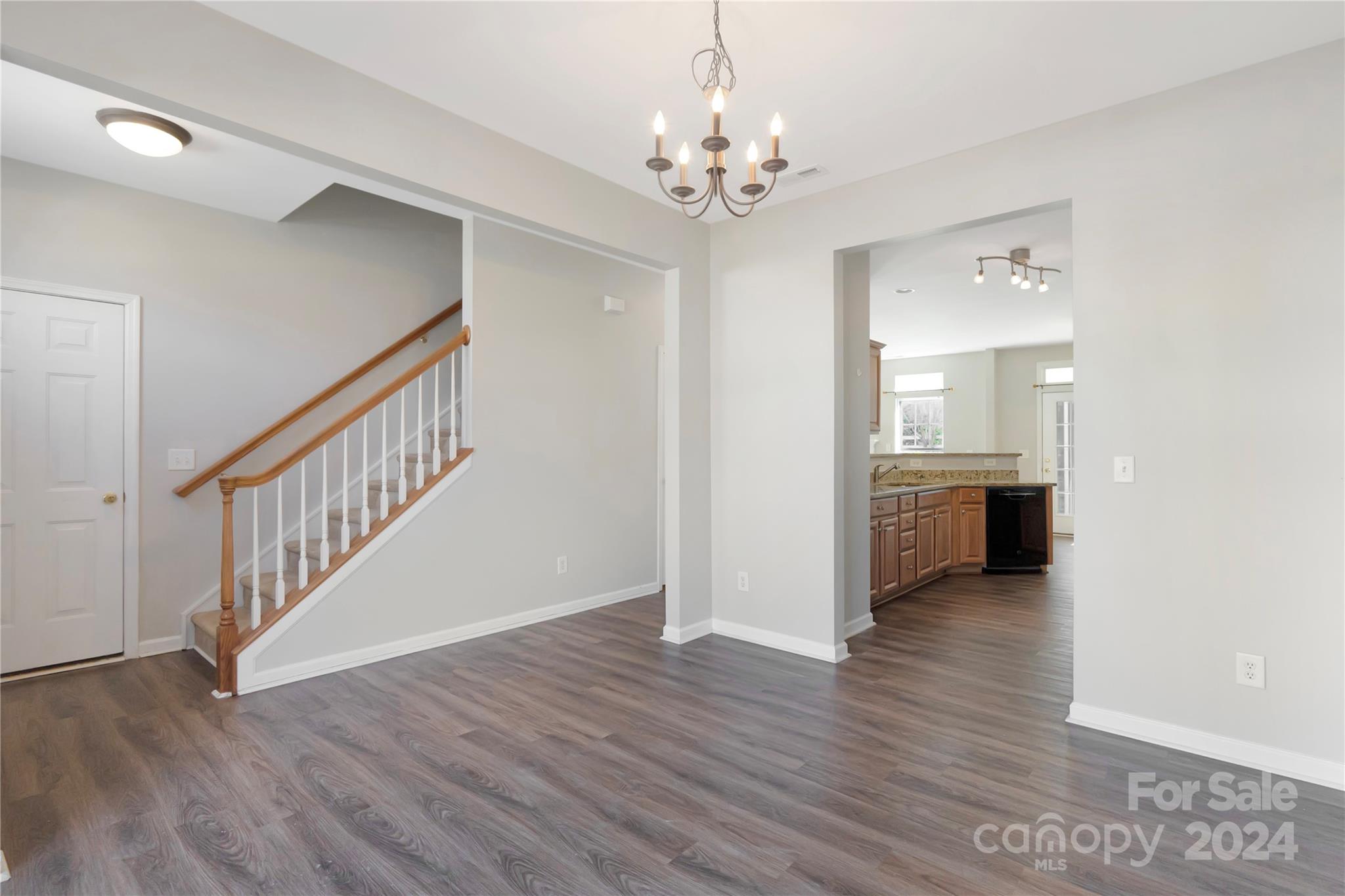 175 Snead Road Fort Mill, SC 29715 - Photo 3 of 26 a view of a room with wooden floor and staircase