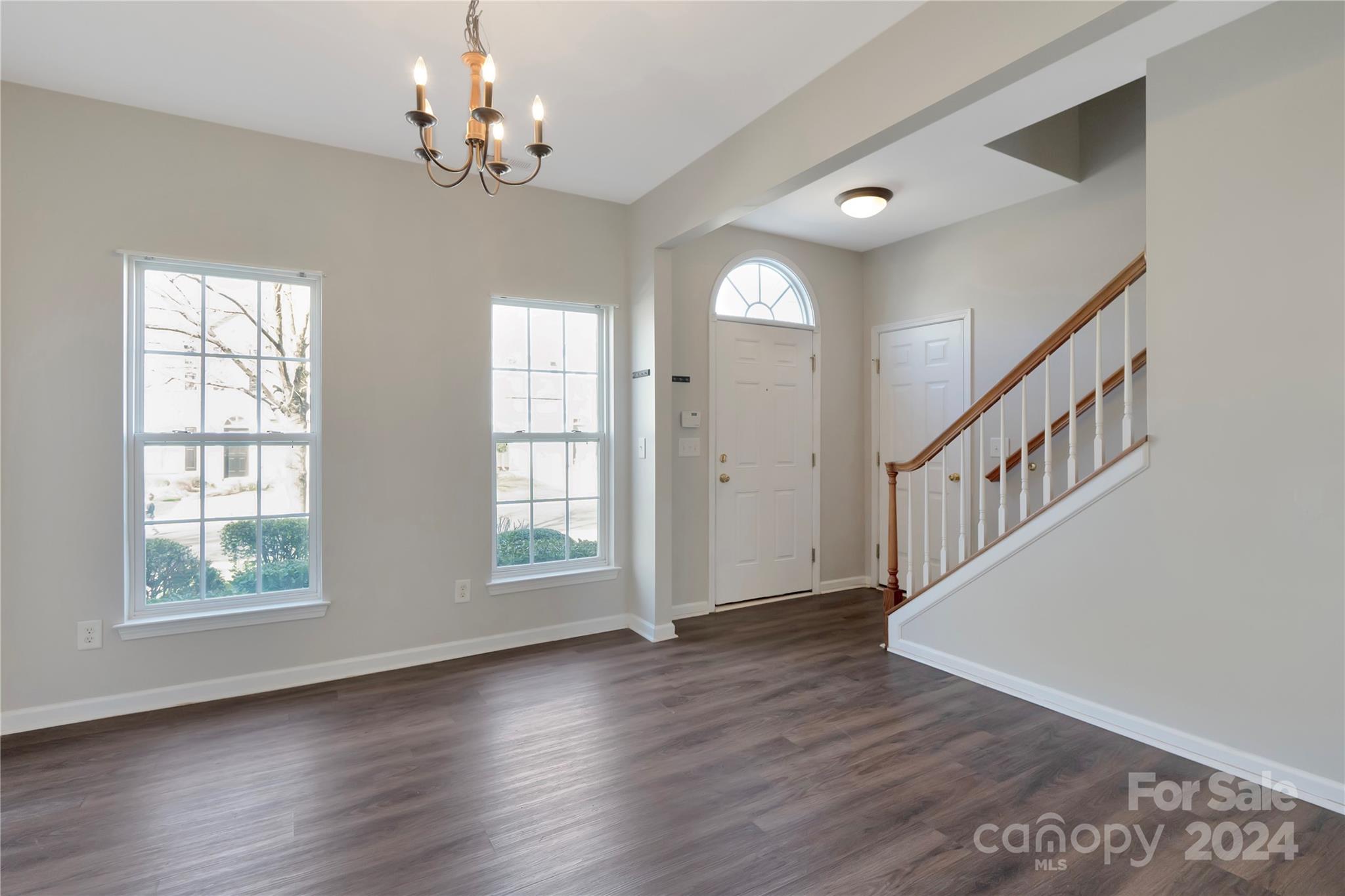 175 Snead Road Fort Mill, SC 29715 - Photo 4 of 26 a view of an entryway with wooden floor and windows