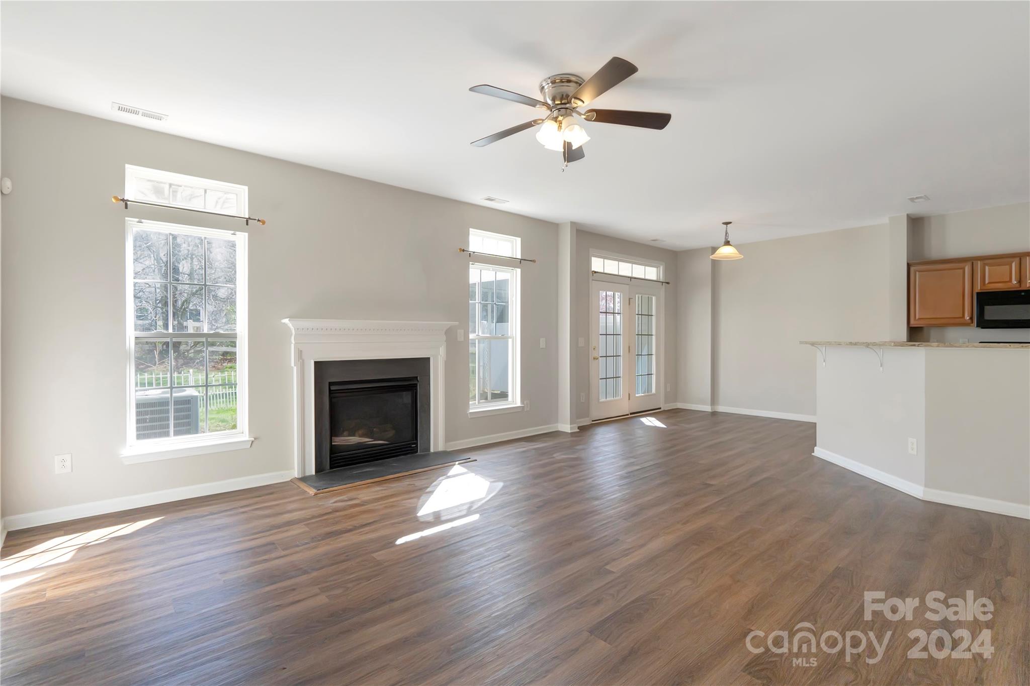 175 Snead Road Fort Mill, SC 29715 - Photo 6 of 26 a view of an empty room with a window and wooden floor