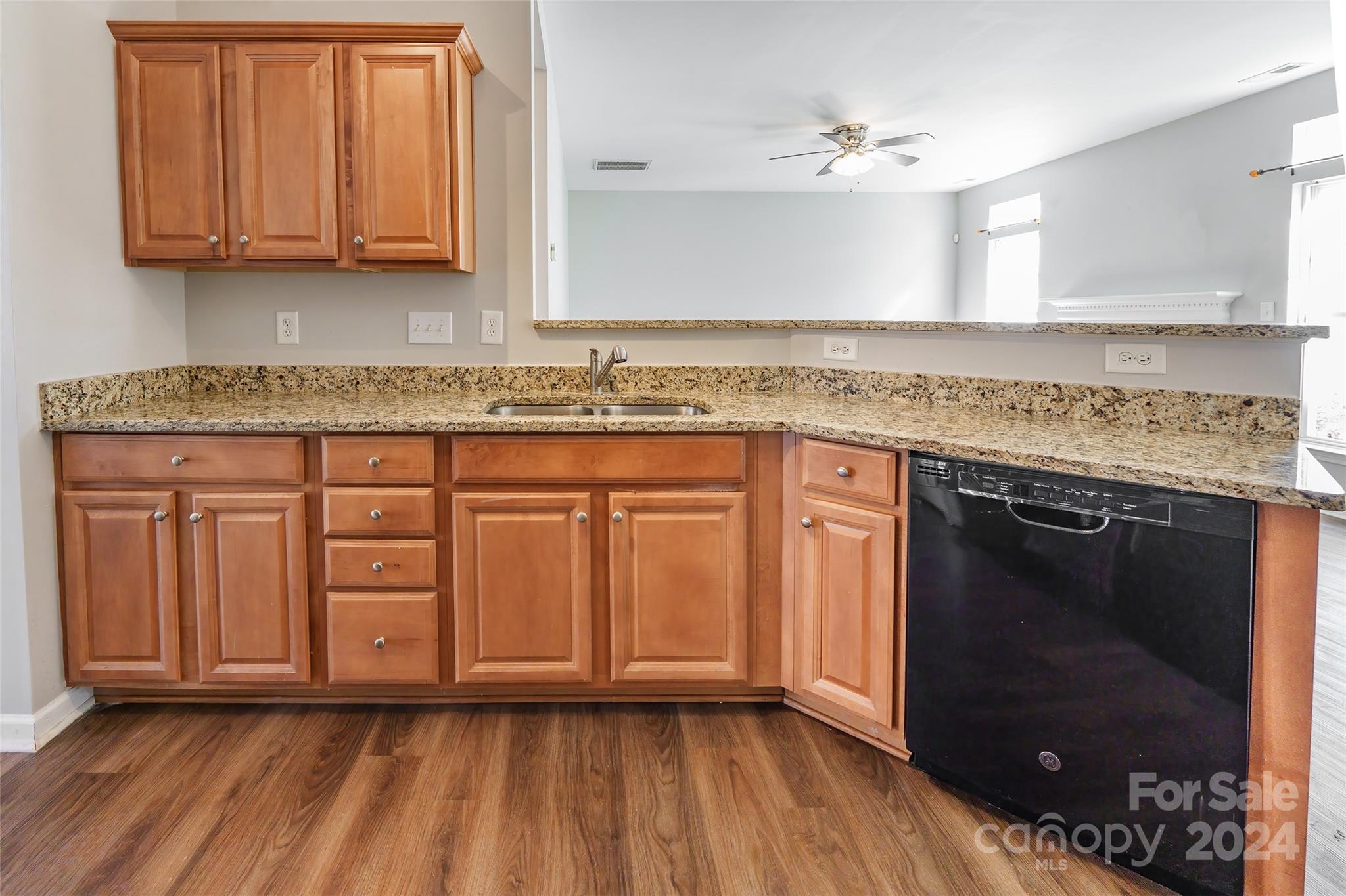175 Snead Road Fort Mill, SC 29715 - Photo 8 of 26 a kitchen with granite countertop a sink cabinets and stainless steel appliances