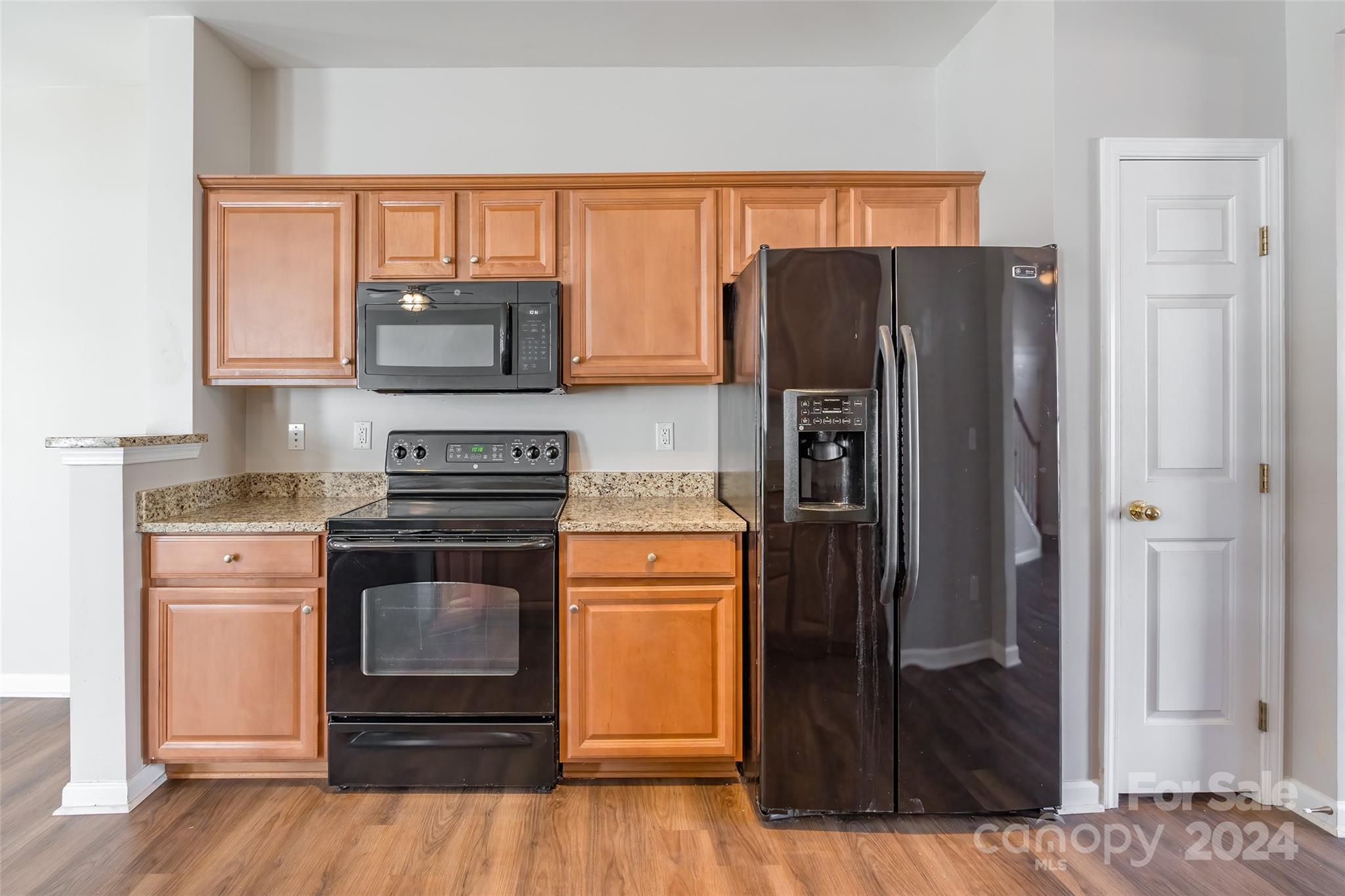 175 Snead Road Fort Mill, SC 29715 - Photo 9 of 26 a kitchen with stainless steel appliances granite countertop a refrigerator and a stove top oven