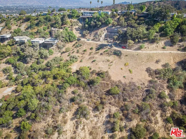 a view of a yard with an outdoor space and trees