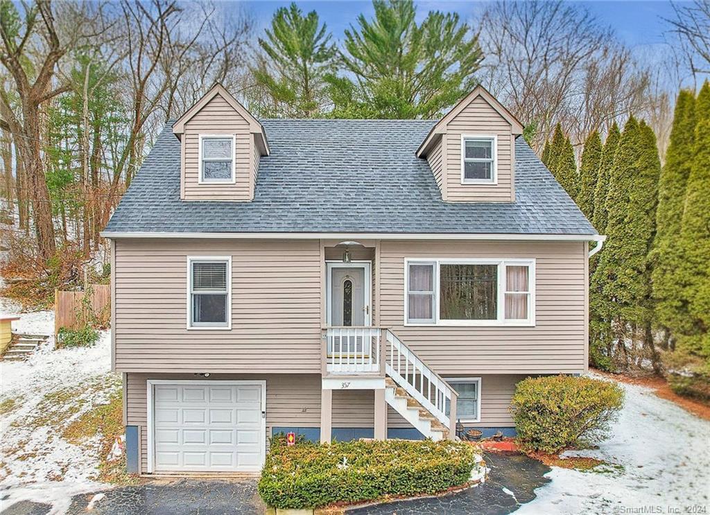357 Beaver Street Ansonia, CT 06401 - Photo 1 of 1 a front view of a house with a yard