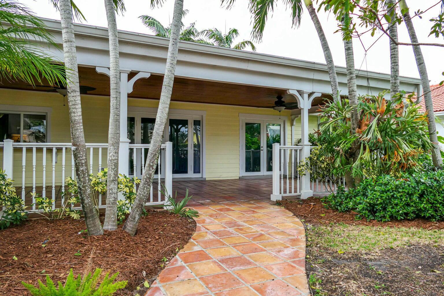 18014 Perigon Way Jupiter, FL 33458 - Photo 24 of 35 a view of a house with a garden