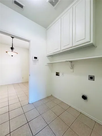 a view of a kitchen with marble wall