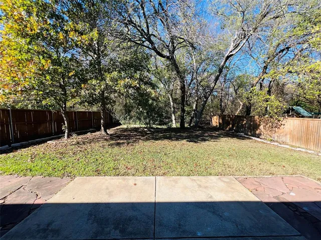 a view of backyard with green space