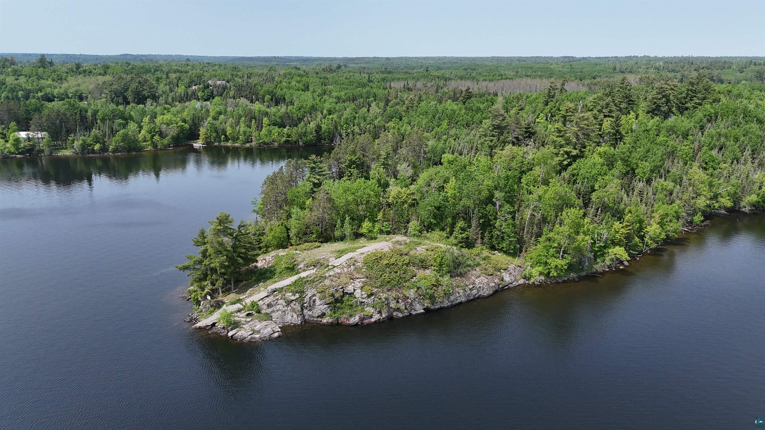 11.82 Bessette Road Orr, MN 55771 - Photo 40 of 44 Aerial view of property and surrounding area with a forest and a large body of water
