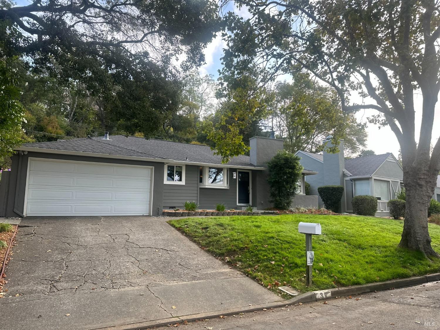 31 Corte Morada Greenbrae, CA 94904 - Photo 1 of 1 a front view of house with yard and trees