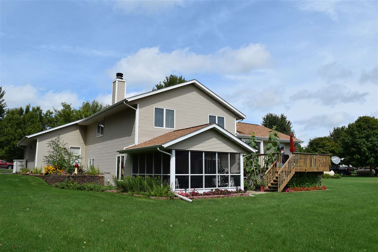 10937 Barron Road Chana, IL 61015 - Photo 1 of 23 a front view of a house with a yard