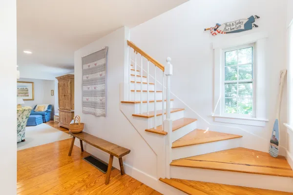 a view of staircase with white walls and windows