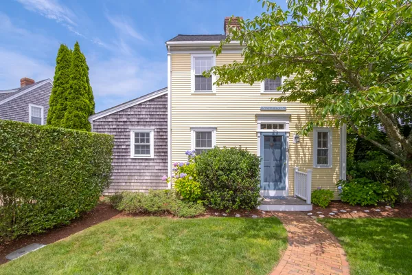 front view of a house with a yard