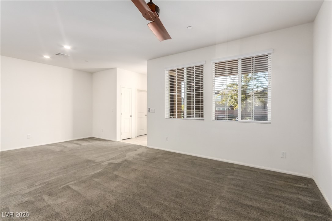 2862 Turnstone Ridge Street Henderson, NV 89044 - Photo 11 of 30 Spare room with dark carpet and recessed lighting