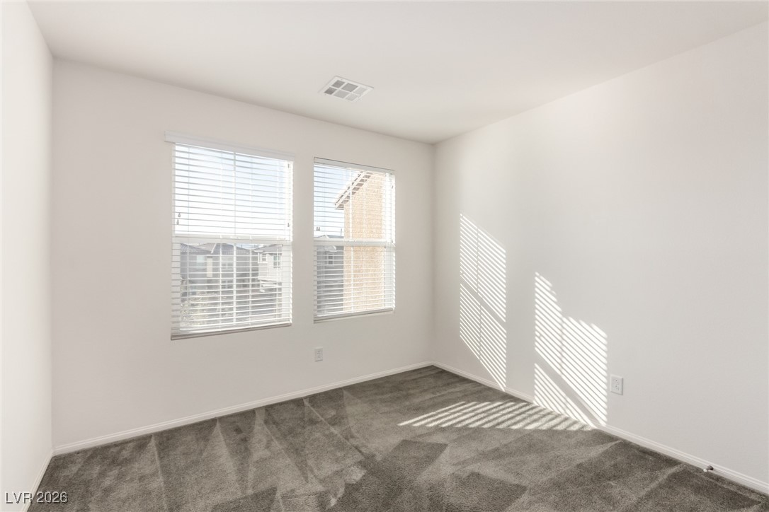 2862 Turnstone Ridge Street Henderson, NV 89044 - Photo 20 of 30 Spare room with dark colored carpet and baseboards
