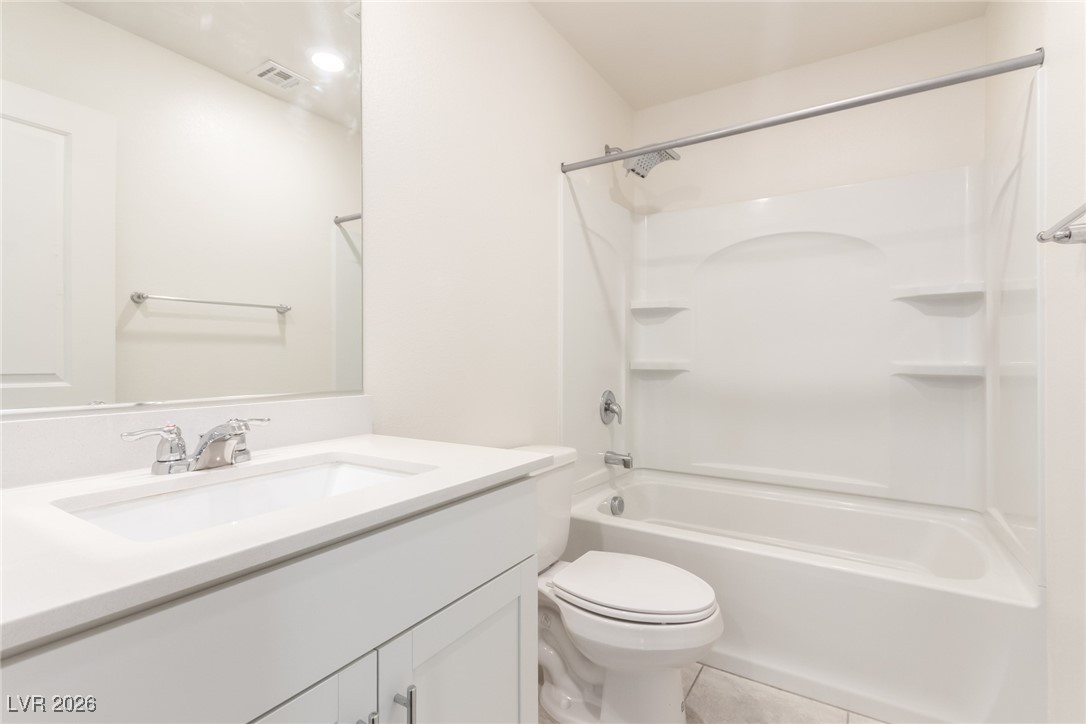 2862 Turnstone Ridge Street Henderson, NV 89044 - Photo 22 of 30 Full bathroom with vanity, shower combination, and tile patterned flooring