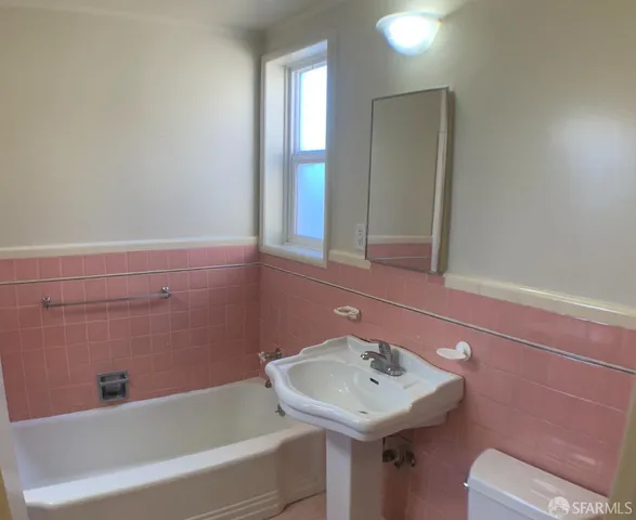 a bathroom with a sink and a bathtub
