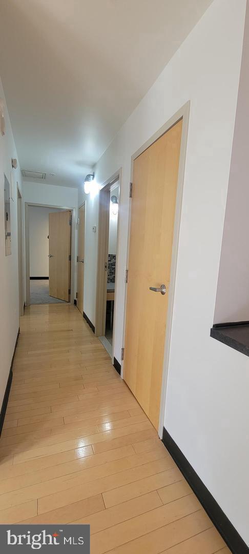 75 Maple Street, Unit 202 Conshohocken, PA 19428 - Photo 21 of 36 a view of a hallway with wooden floor