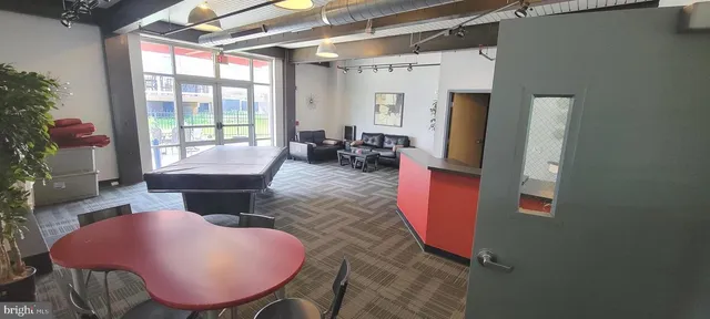 a living room with furniture fireplace and flat screen tv