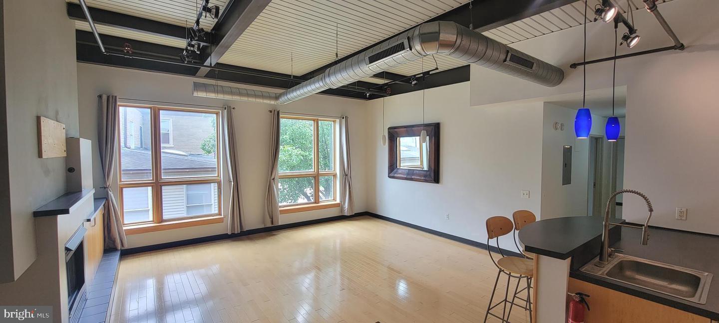 75 Maple Street, Unit 202 Conshohocken, PA 19428 - Photo 3 of 36 a view of an empty room with windows