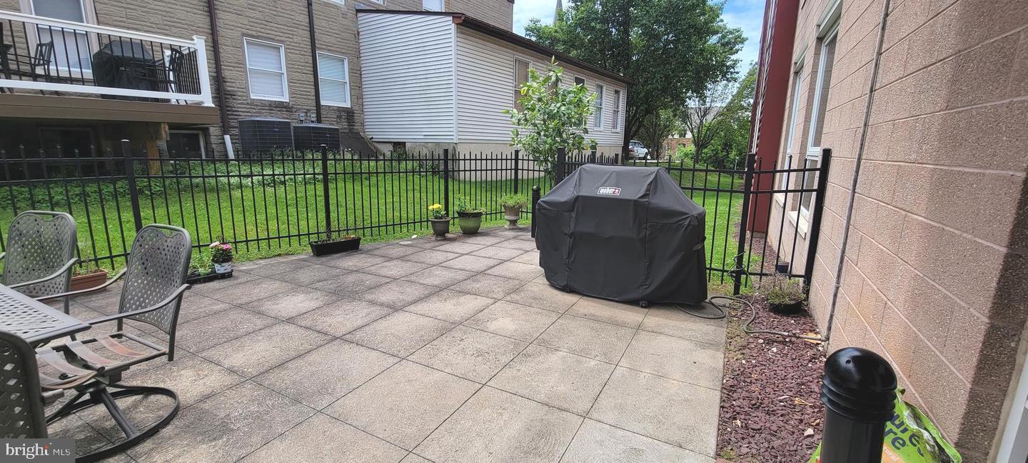 75 Maple Street, Unit 202 Conshohocken, PA 19428 - Photo 31 of 36 a view of a chair and table in backyard of the house