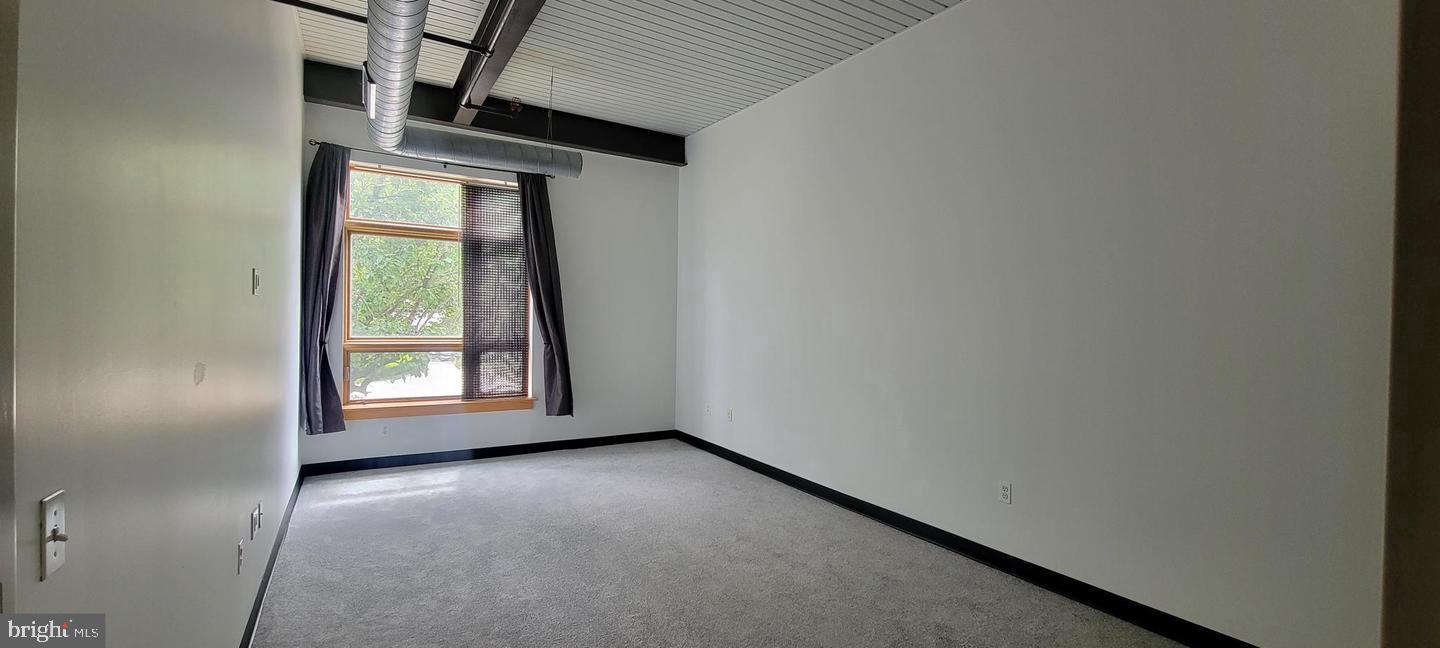 75 Maple Street, Unit 202 Conshohocken, PA 19428 - Photo 9 of 36 an empty room with windows